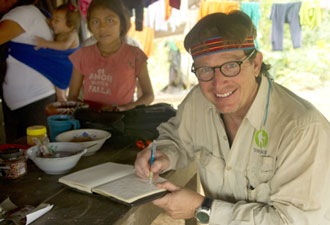 Dean Jacobs writing in journal in the Amazon