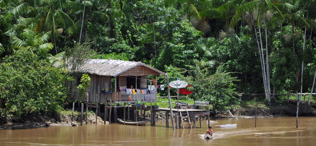 Family living on the Amazon river bank